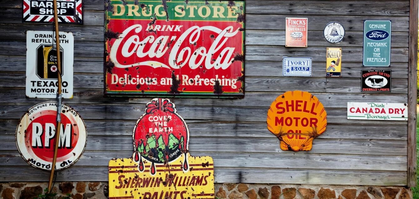 drug store drink coca cola signage on gray wooden wall