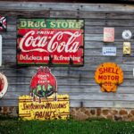 drug store drink coca cola signage on gray wooden wall