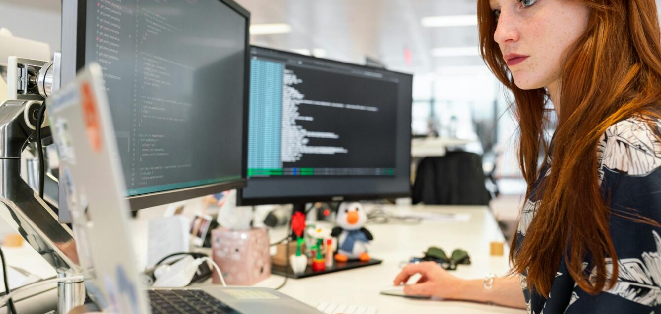 woman coding on computer