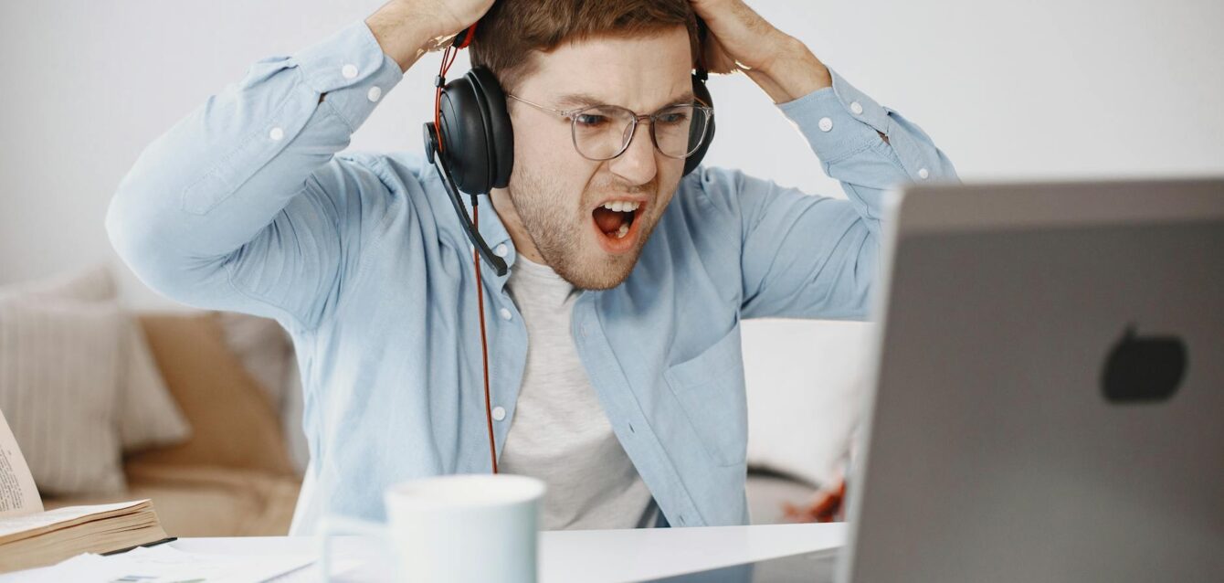 frustrated man working in home office